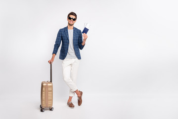 Full length body size view of nice attractive stylish cheerful cheery tourist wearing blue checked blazer holding in hands documents departure destination isolated over light white pastel background