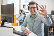 © Bojan - Happy handsome technical support operator with headset showing ok gesture to the camera
