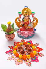 Indian Festival Diwali , Laxmi Pooja with Copper Kalash, coconut flower rangoli on white background