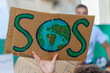 Fridays for future: student hand showing  board