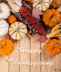 Wall Mural - Happy Thanksgiving Text With Indian Corn and Mini Pumpkins