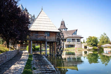 Old vintage water mill by the lake in ethno village Stanisici near the Bijeljina in Bosnia and Herzegovina