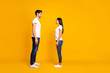 © deagreez - Full body profile photo of pair lady and guy looking eyes wait who begin conversation wear casual outfit isolated yellow color background