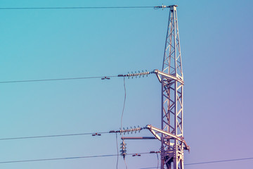 High voltage tower on sky background