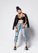 © Dmitry Lobanov - Punk style grunge girl in torn jeans, leather top, jacket, winter hat and brutal untied chrome boots on white
