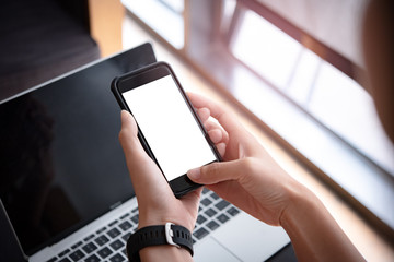 Poster - woman hand holding smartphone with blank screen for design or Advertisement.