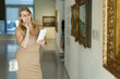 © JackF - Woman with booklet looking at exhibits