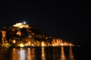 Wall Mural - Saint Michaels Fort in Sibenik, Croatia between sunset and night.