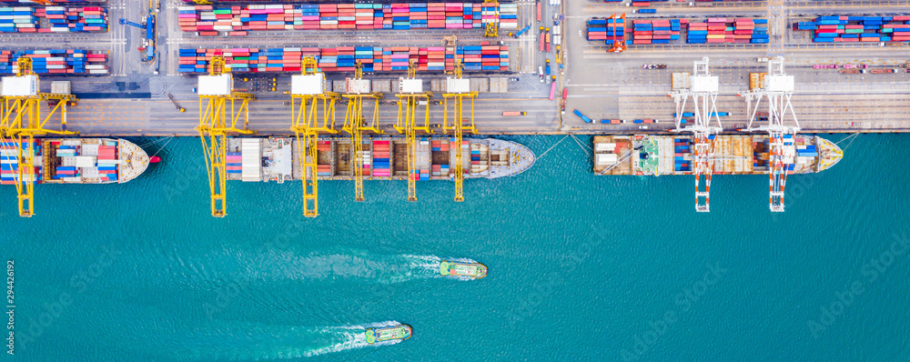 Top view of Deep water port with cargo ship and containers. It is an import and export cargo port where is a part of shipping dock and export products worldwide - obrazy, fototapety, plakaty 