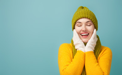 Wall Mural - Winter portrait of happy young woman