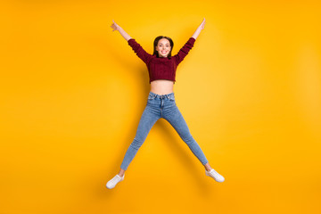 Poster - Fulll body photo of charming lady raising her arms wearing maroon pullover isolated over yellow background