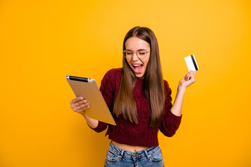 Sticker - Portrait of her she nice-looking attractive charming cheerful cheery excited ecstatic straight-haired girl shopper buying on web isolated over bright vivid shine yellow background