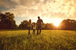© Studio Romantic - Happy family walks on the park at sunset.