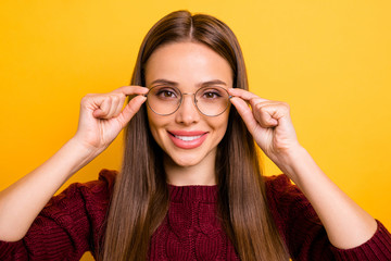 Poster - Close up photo of pretty teacher touching her specs wearing maroon sweater isolated over yellow background