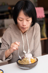 Canvas Print - Asian woman eat shaved ice