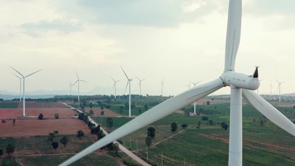 Wall Mural - Aerial view of many wind turbine in large field for generate electrical power. Wind turbine is a wind energy converter, is a device that converts the wind's kinetic energy into electrical energy.