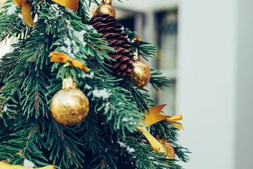 Wall Mural - Green fir tree with golden balls. Christmas wallpaper.