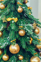 Wall Mural - Green fir tree with golden balls. Christmas wallpaper.
