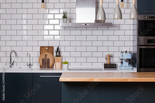 Cuadros en Lienzo Kitchen with white tiles and dark furniture