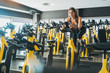 Woman in spinning class in gym