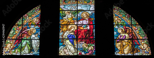 Fotografía ARCO, ITALY - JUNE 8, 2018: The Annunciation in the stained glass in the church Chiesa Collegiata dell'Assunta