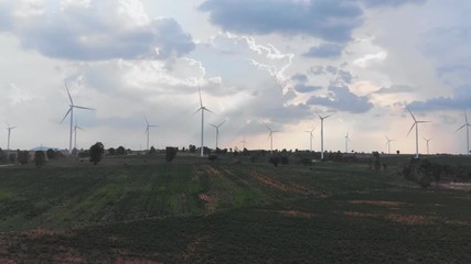 Wall Mural - Aerial view of many wind turbine in large field for generate electrical power. Wind turbine is a wind energy converter, is a device that converts the wind's kinetic energy into electrical energy.