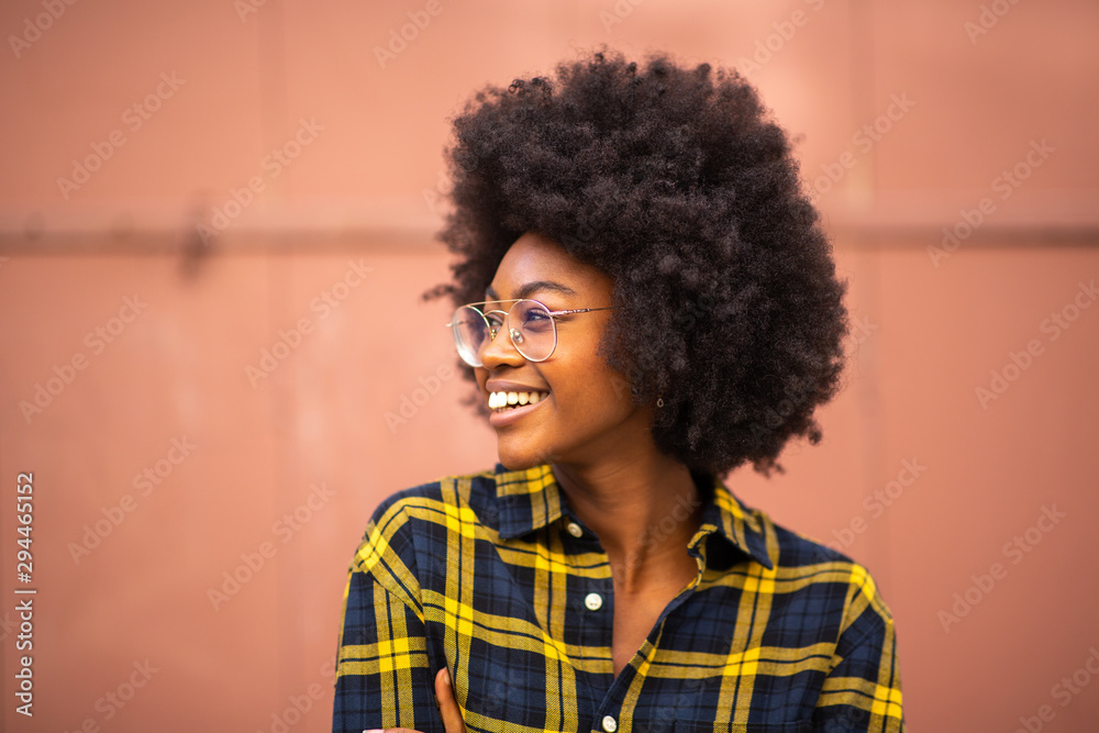 young african american woman with afro and glasses looking away - obrazy, fototapety, plakaty 