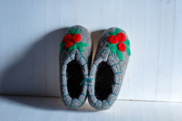 felted embroidered wool Slippers on the sole, shot on a white background