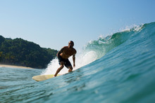 Surfer Surfing On Sea Wave