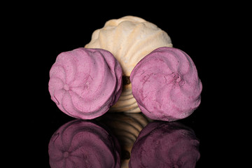 Group of three whole fresh pastel zefir isolated on black glass