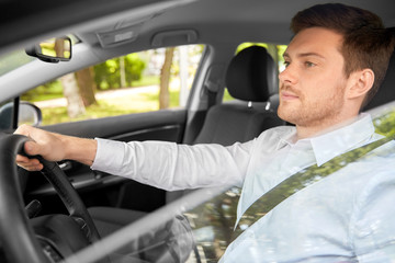 Wall Mural - transport, vehicle and people concept - man or driver driving car in summer