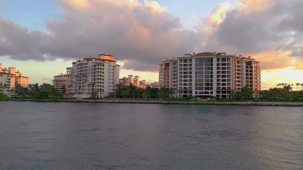 Wall Mural - Beautiful Fisher Island Miami Beach landscape sunset green golf courses 4k drone aerial