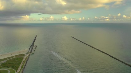 Wall Mural - Miami Beach inlet to the Atlantic Ocean shot with an aerial drone 4k