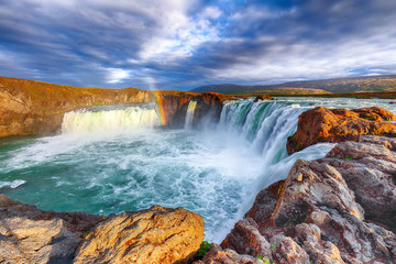 Wall Mural - breathtaking sunset landscape scene of powerful godafoss waterfall