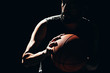 © kleberpicui - Dramatic portrait of basketball player over dark background