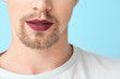 © Pixel-Shot - Young transgender woman on color background, closeup