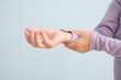 © Pixel-Shot - Senior woman suffering from pain in wrist against light background