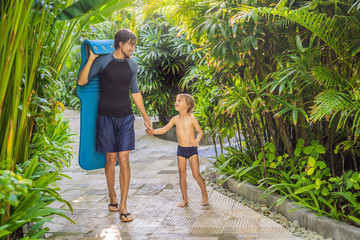 Wall Mural - Dad and son have fun at the water park