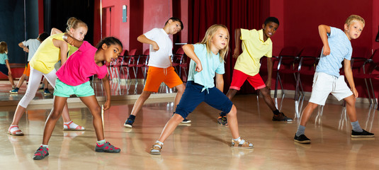 Children studying modern style dance