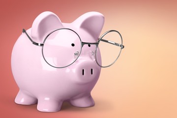  Piggy bank in glasses and books on background