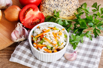 Sticker - Boiled rice with vegetables in a white ribbed bowl.