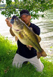 © sablin - Bass fishing, man holding a big bass. Lure fishing