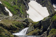 © sablin - Trout fishing in the mountain A man fishes trouts in a high mountain lake, France, europe