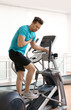 © New Africa - Young man having heart attack on treadmill in gym