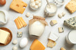 Different delicious dairy products on white table, flat lay