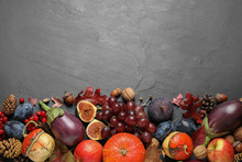 Flat Lay Composition With Autumn Vegetables And Fruits On Grey Background, Space For Text. Happy Thanksgiving Day