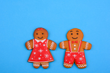 Christmas homemade gingerbread cookies on a bright colored background. New Year discount sale