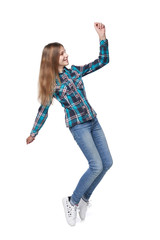 Teen girl in checkered shirt dancing standing on tiptoe