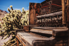 Old Vintage Broken Piano Rotting Away In A Ghost Town In The Desert Of Nevada