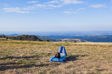 Wall Mural - Hiker woman relaxing after walking